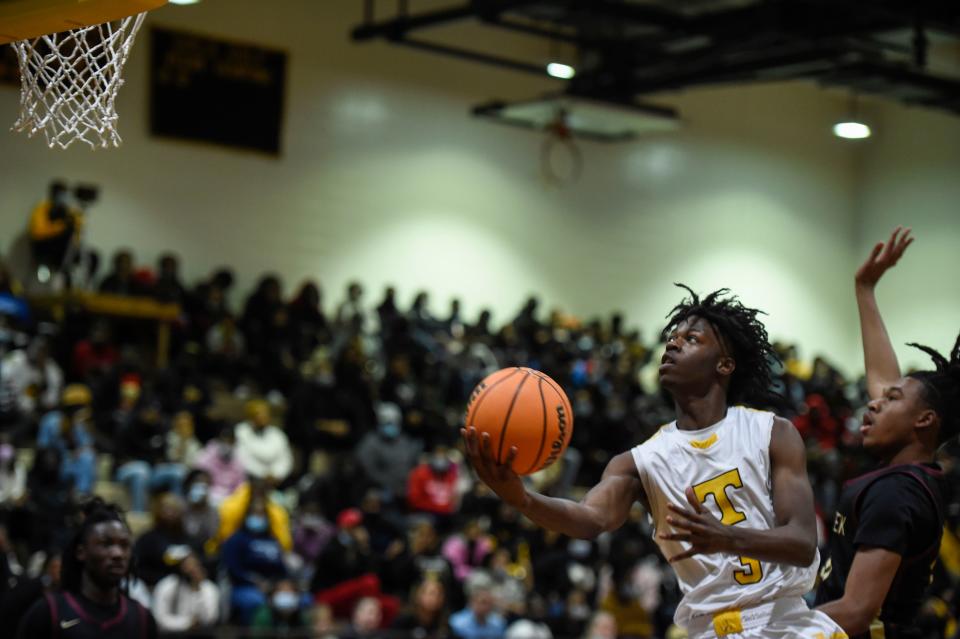 Thomson's Ty Braswell glides into the lane for a shot on Jan. 28.