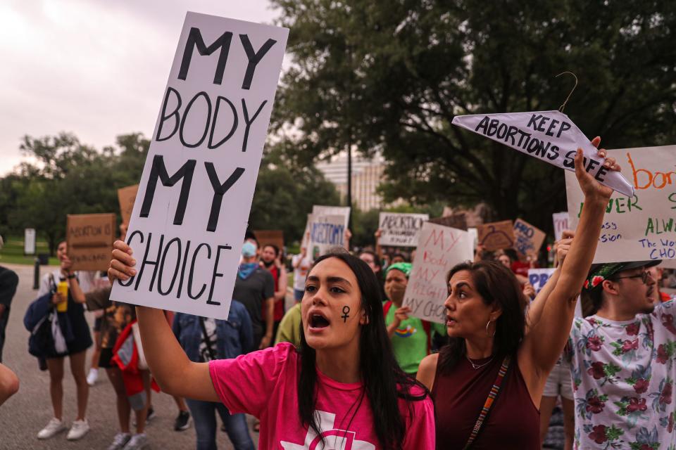 Libby Brooker, an Austin-area high school student, joins a crowd of abortion rights protesters at the Capitol in May. On Thursday, a state district judge in Bexar County dismissed a lawsuit against a doctor who in 2021 publicly announced he had violated Texas' restrictions on abortion,
