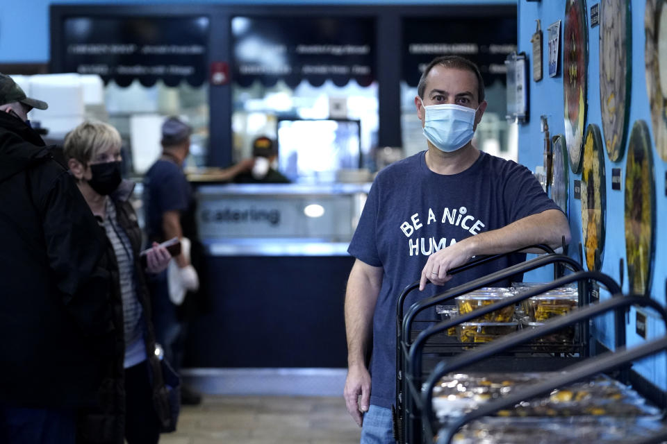 Steve Geffen poses for a photo at Once Upon a Bagel restaurants in Highland Park, Ill., Thursday, Dec. 16, 2021. U.S. restaurants are entering their second winter of the pandemic on firmer footing. Their doors are open, and many dining rooms are full again. But the industry remains anxious, squeezed by labor shortages and food prices and unsure if the omicron variant will once again drive diners away. (AP Photo/Nam Y. Huh)