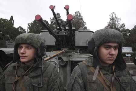 Russian marines take part in a military parade during celebrations marking the forces' annual holiday in the Crimean port of Sevastopol, November 29, 2014. REUTERS/Pavel Rebrov