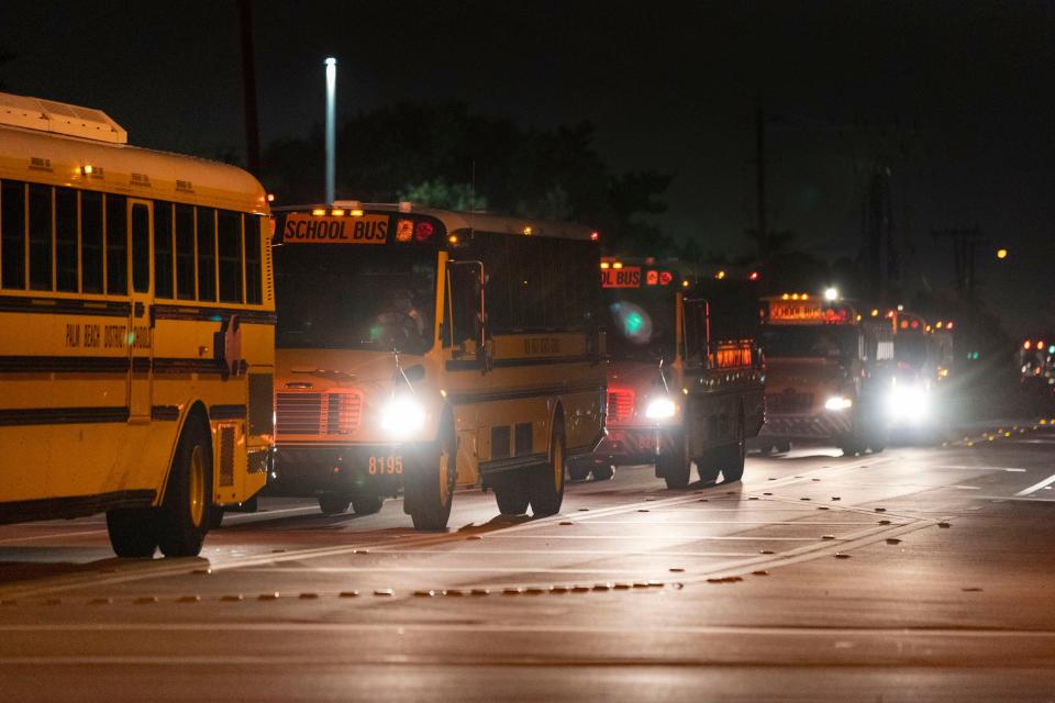 Palm Beach County School bus drivers take off to pick up students on the first day of school in 2021. The district is consistently short more than 100 bus drivers each day.