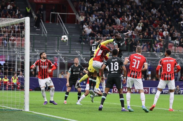 Ibrahima Konate, centre right, rises above a crowd of players and in front of goalkeeper Mike Maignan to head Liverpool's equaliser against AC Milan