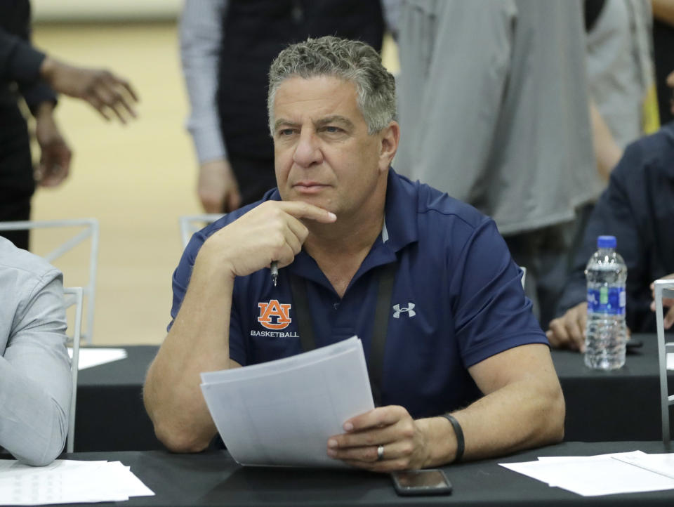 FILE – In this May 17, 2018, file photo, Auburn head coach Bruce Pearl attends the NBA draft basketball combine in Chicago. Auburn has given basketball coach Bruce Pearl a five-year contract extension. Pearl led the Tigers to a share of their first Southeastern Conference regular season title since 1999 last season despite having two top players ineligible. The extension announced Monday, June 4, 2018, runs through the 2022-2023 season. (AP Photo/Charles Rex Arbogast, File)