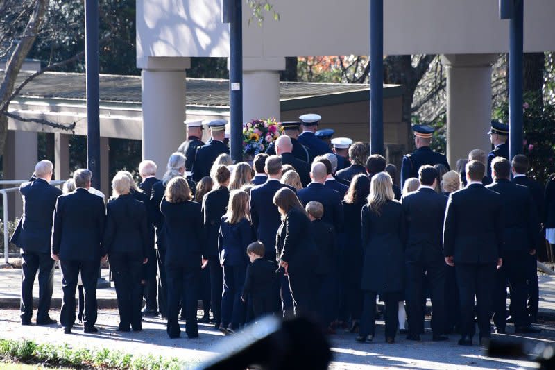 Mourners gather as the casket carrying the remains of former first lady Rosalynn Carter arrives at the Jimmy Carter Presidential Library and Museum in Atlanta, Georgia on Monday. Photo by Scott Cunningham/UPI