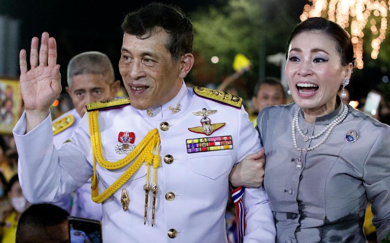 The Thai king and queen greet supporters outside their Bangkok palace - Rungroj Yongrit/EPA-EFE/Shutterstock