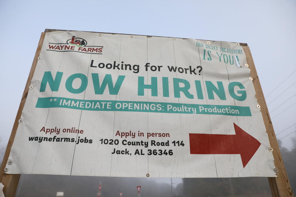 A sign advertising immediate openings at the Wayne Farms poultry processing plant is displayed in Enterprise, Alabama, December 3, 2021. REUTERS/Alyssa Pointer