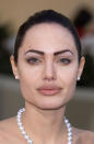 <b>Angelina Jolie:</b> Once heavy-handed with her makeup, Angelina favoured bold brows and lashings of liner.