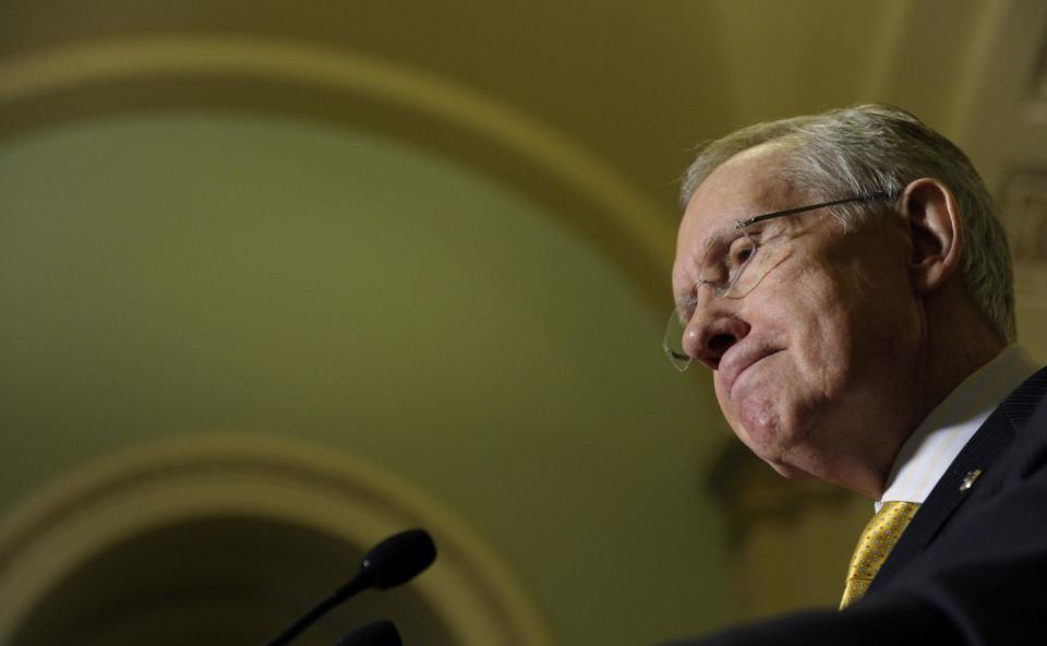 Senate Majority Leader Harry Reid of Nev. pauses during a news conference on Capitol Hill in Washington, Tuesday, Jan. 14, 2014, following a Democratic policy lunch. A massive $1.1 trillion spending bill, aimed at funding the government through October and putting to rest the bitter budget battles of last year, is getting generally positive reviews from House Republicans who are eager to avoid another shutdown crisis with elections looming. (AP Photo/Susan Walsh)