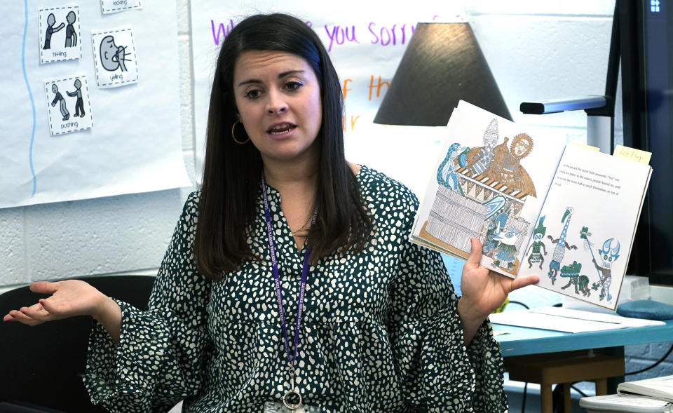 First grade teacher, Lindsey Land, instructs her students during classes at Chimborazo Elementary School Thursday, Nov. 17, 2022, in Richmond, Va. The Richmond school district, which includes Chimborazo elementary, ultimately decided against year-round school. (AP Photo/Steve Helber)