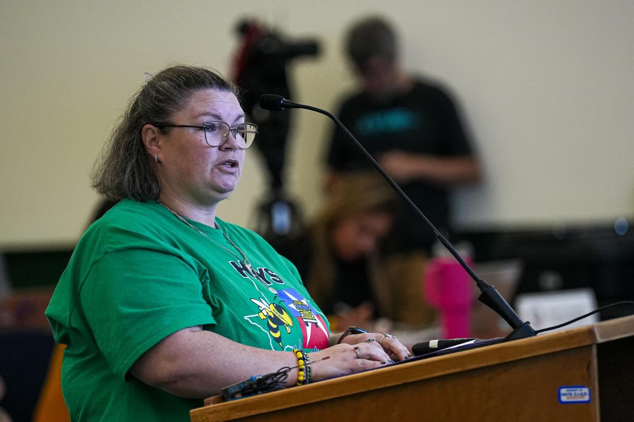 Kaitlyn Holden, a Hays CISD bus driver and parent speaks at a Hays Consolidated Independent School District Board of Trustees special meeting on the district's school bus seat belt plan at the Historic Buda Elementary Campus on Monday, April 15, 2024 in Buda, Texas.