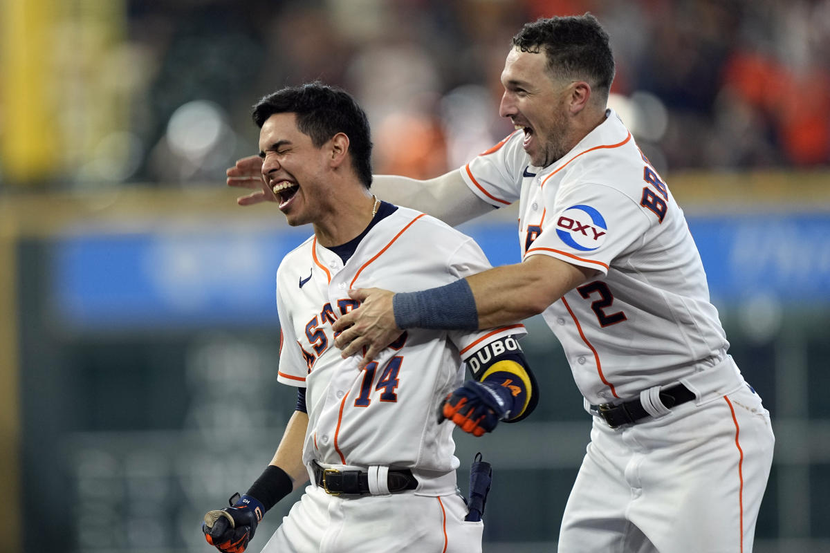 Houston Astros shortstop Mauricio Dubon (14) hits an RBI single to left  field in the bottom of the fifth inning of the MLB game between the Houston  As Stock Photo - Alamy