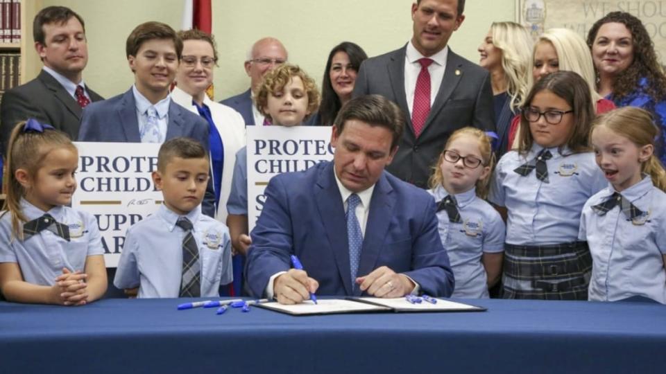 Florida Gov. Ron DeSantis signs the Parental Rights in Education bill at a school in Shady Hills on March 28, 2022. The measure, which some called the “don’t say gay” bill, is the kind of legislation the HRC says contributes to a dangerous climate for LGBTQ people. (Photo: Douglas R. Clifford/Tampa Bay Times via AP, File)