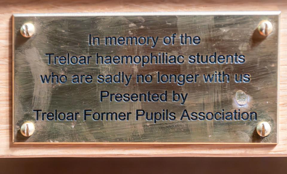 Holy Rood Church, Holybourne near Alton, Hampshire, England, UK, April 2024. Memorial plaque on a church pew in honor of the haemophiliac students at Treloar who are sadly no longer with us.  Historically, Lord Mayor Treloar School has been associated with the infected blood scandal, and former students with haemophilia have taken legal action against the school for giving them contaminated blood products infected with HIV and hepatitis in the 1970s and 1980s.