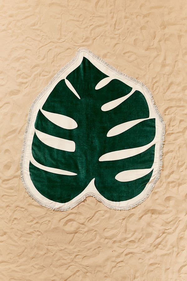 Get it on <a href="https://www.urbanoutfitters.com/shop/bando-monstera-leaf-oversized-beach-towel" target="_blank">Urban Outfitters</a>, $68.&nbsp;