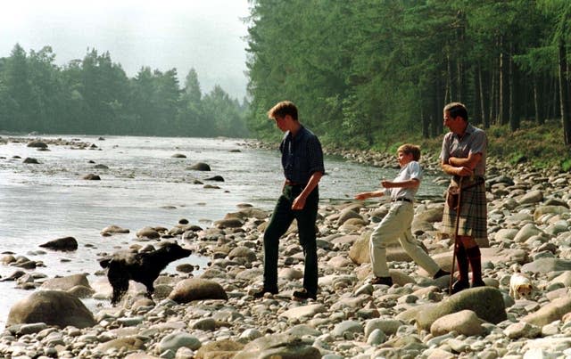Charles and his sons William and Harry on the banks of the River Dee on the Balmoral Estate in 1997
