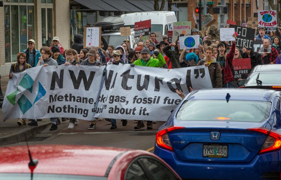 Students march down Willamette Street in Eugene in protest of NW Natural's effort to roll back the gas ban in Eugene.