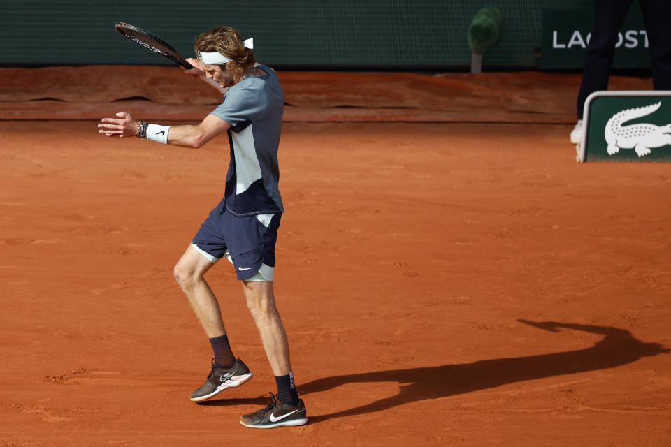 Russia's Andrey Rublev reacts after missing a shot against Croatia's Marin Cilic during their quarterfinal match at the French Open tennis tournament in Roland Garros stadium in Paris, France, Wednesday, June 1, 2022. (AP Photo/Jean-Francois Badias)