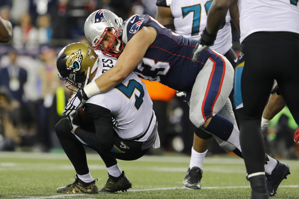 <p>Jacksonville Jaguars quarterback Blake Bortles (5) is brought down by New England Patriots defensive end Lawrence Guy (93) during the third quarter in the AFC Championship Game at Gillette Stadium. Mandatory Credit: David Butler II-USA TODAY Sports </p>