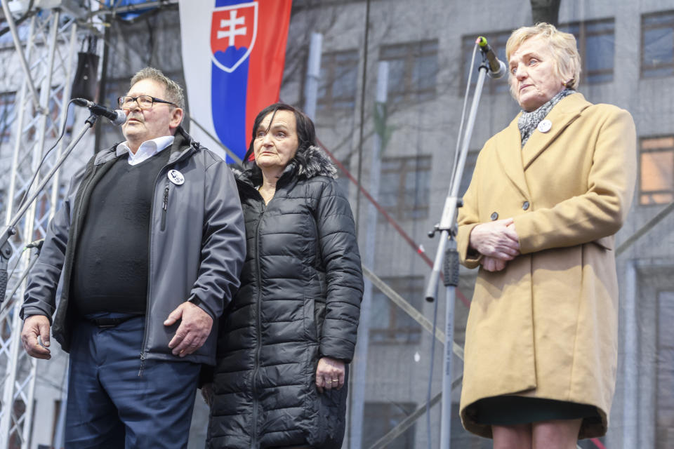 Late journalist Jan Kuciak's parents, left, and late journalist Martina Kusnirova mother, right, speak on the stage during the initiative ''For a decent Slovakia'', on the 6th anniversary of the murder of Jan Kuciak and Martina Kusnirova, in Bratislava, Slovakia, Wednesday Feb. 21, 2024. Thousands rallied in dozens of cities and towns across Slovakia on Wednesday to mark the sixth anniversary of the slayings of an investigative journalist and his fiancee amid a wave of anti-government protests. (Jaroslav Novák/TASR via AP)