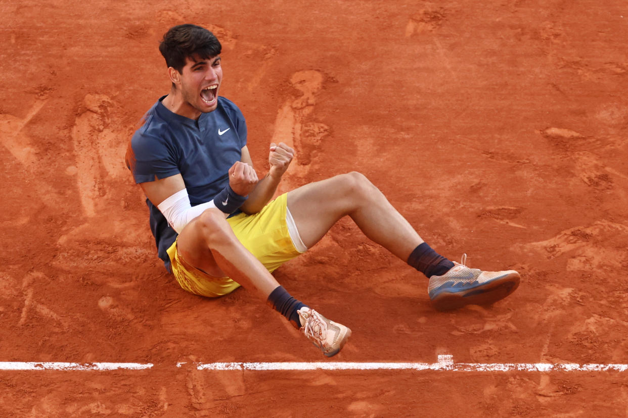 Spain's Carlos Alcaraz celebrates after winning his men's singles final match against Germany's Alexander Zverev on Court Philippe-Chatrier on day fifteen of the French Open tennis tournament at the Roland Garros Complex in Paris on June 9, 2024. (Photo by EMMANUEL DUNAND / AFP) (Photo by EMMANUEL DUNAND/AFP via Getty Images)