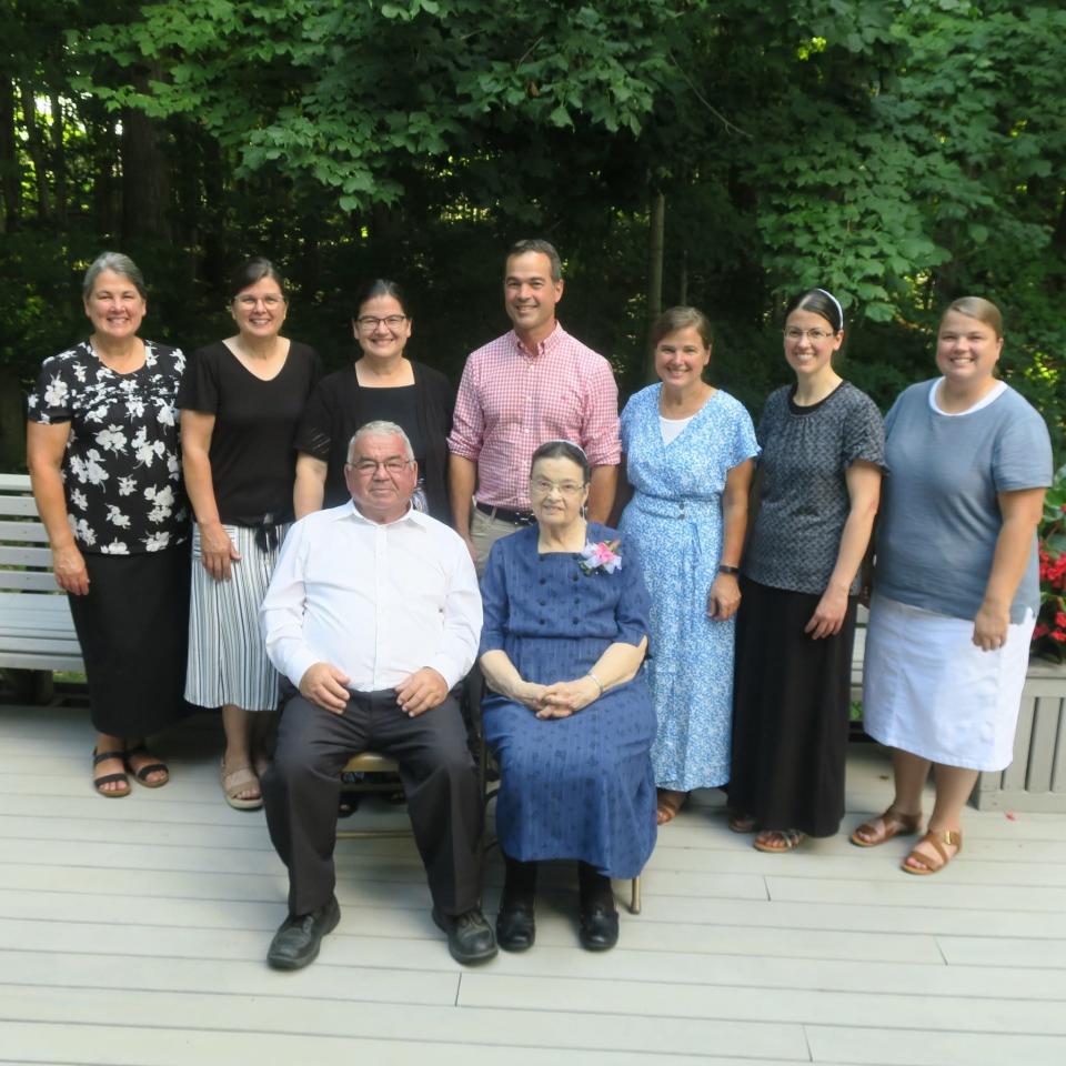 The late Detroit neurosurgeon Devon Hoover, rear center, with his sisters, from left, Diana Wenger, Lila Graber, Linda Hershberger, Beth Lechlitner, Andrea Martin, Laurie Hoover and their parents Clarence and Lauretta Hoover. The siblings were gathered for their parents 60th wedding anniversary in 2022.