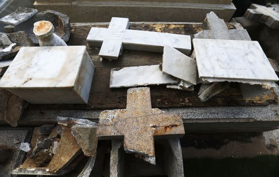 Broken headstones pile up in a cemetery in the immediate aftermath of Hurricane Maria.