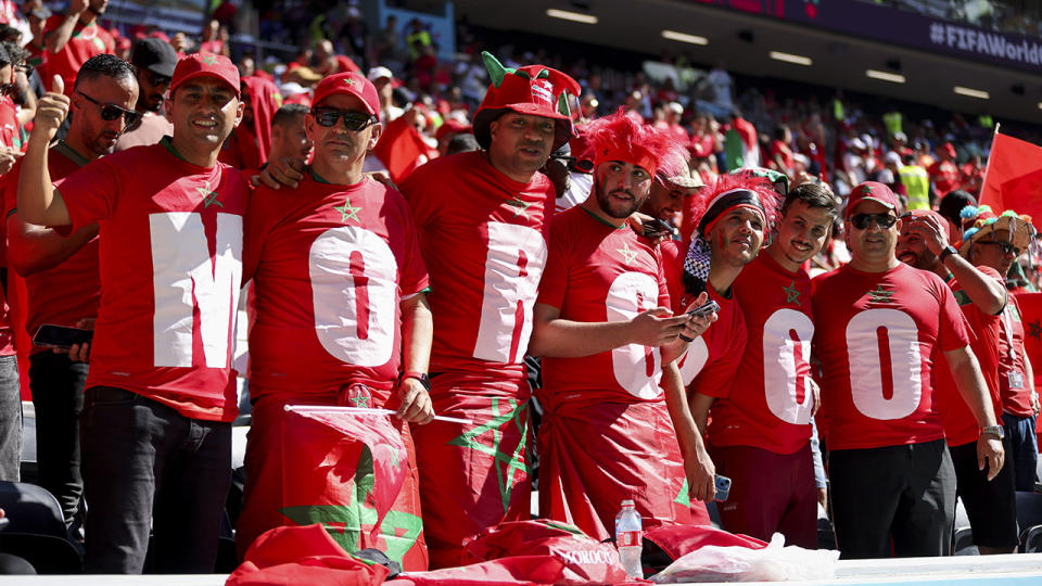 Moroccan fans are pictured cheering their team on at the 2022 FIFA World Cup.