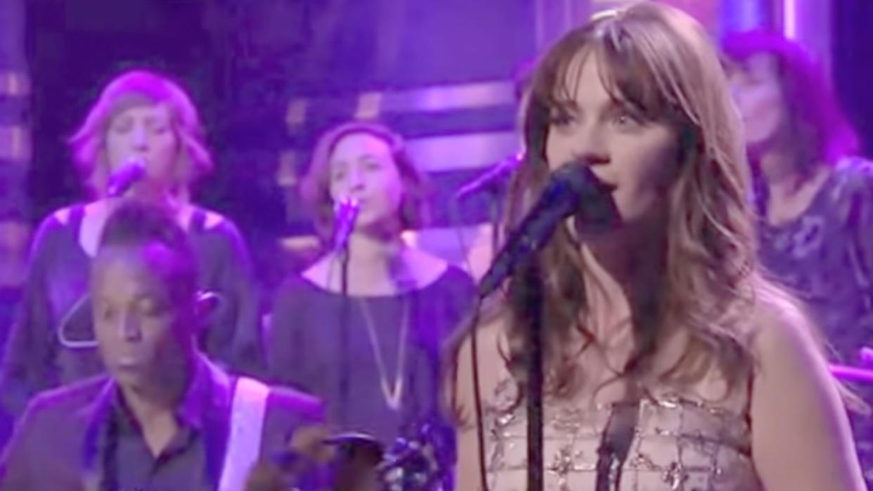  Zooey Deschanel performing on the Tonight Show. 