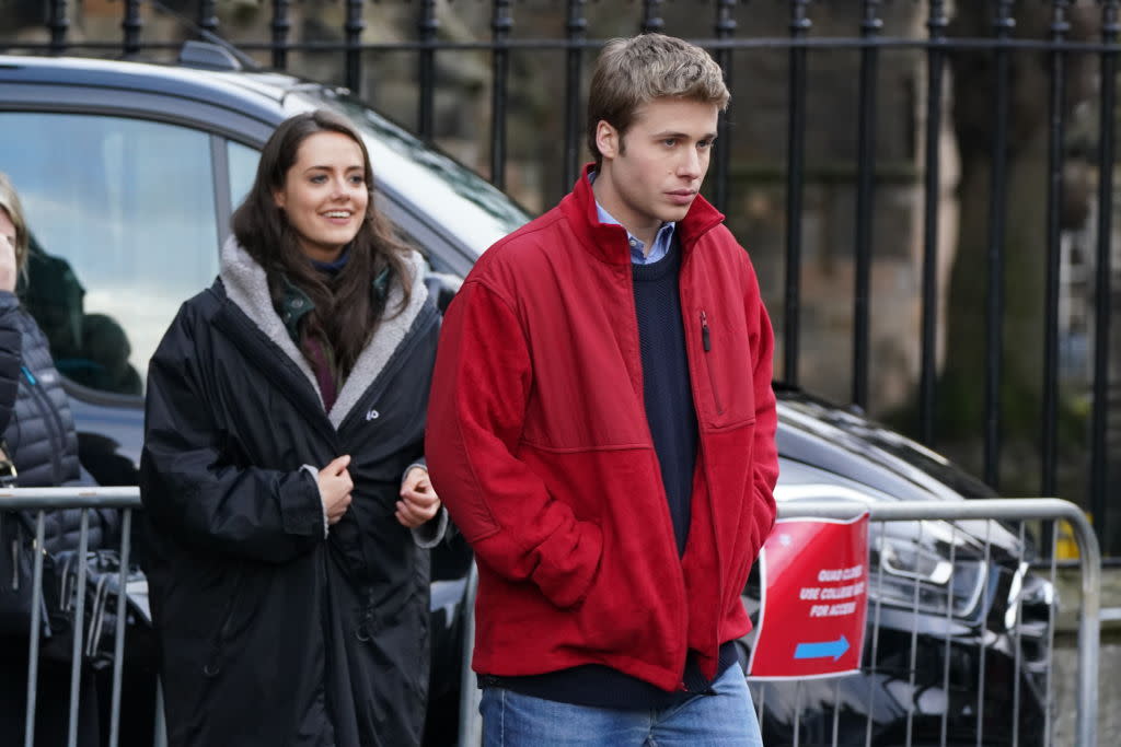 Meg Bellamy and Ed McVey take a break Thursday while filming 