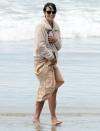 <p>Jordana Brewster bundles up in a fleece jacket on the beach on Tuesday in Malibu. </p>