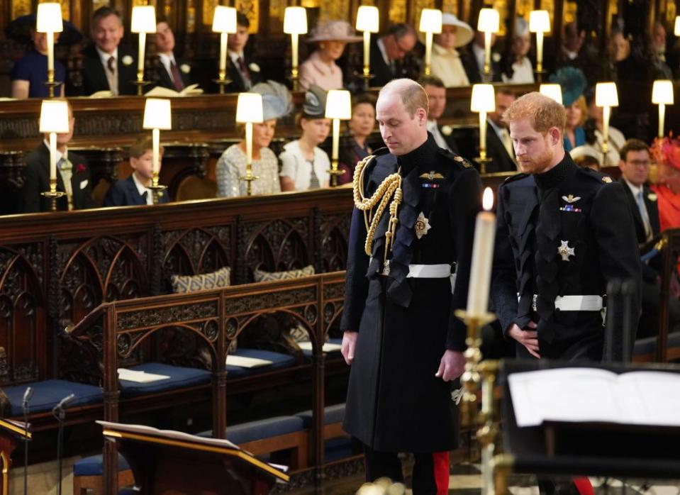 Harry and William wait at the altar.