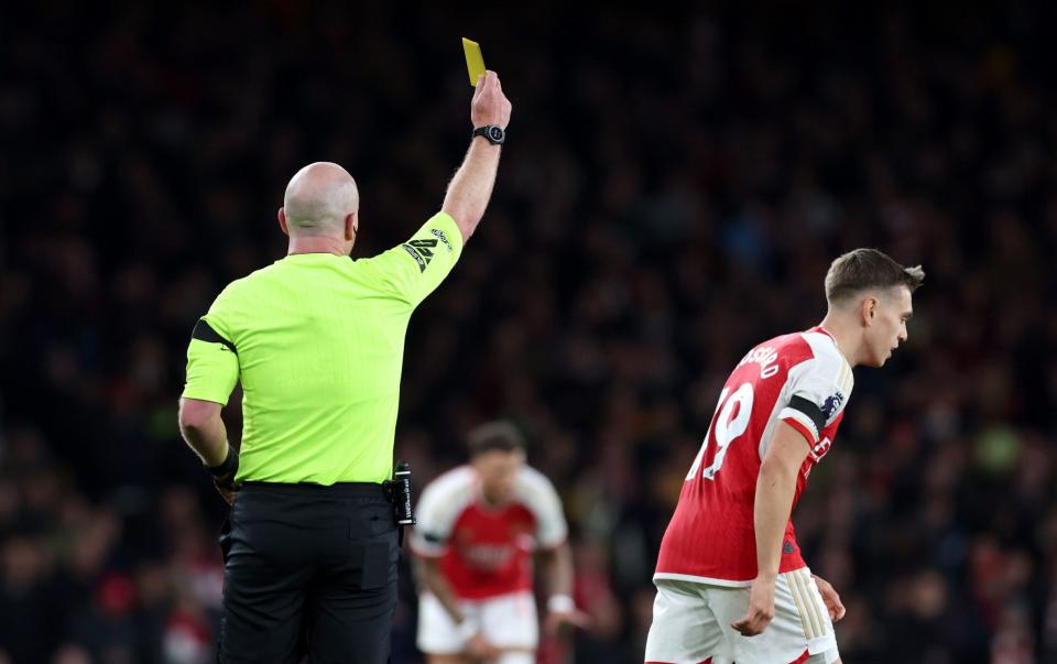 Leandro Trossard booked by referee Simon Hooper