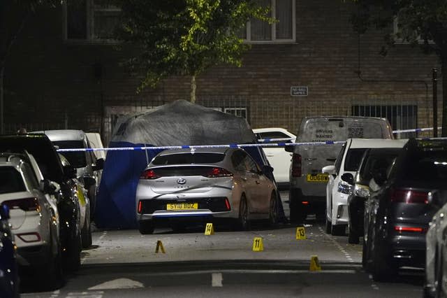 Crime scene markers on Overbury Street near the scene in Rushmore Road, Clapton, east London