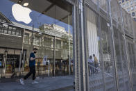 Security gates surround the Apple store on Thursday, June 3, 2021 in Portland, Ore. Until a year ago, the city was best known nationally for its ambrosial food scene, craft breweries and “Portlandia” hipsters. Now, months-long protests following the killing of George Floyd, a surge in deadly gun violence, and an increasingly visible homeless population have many questioning whether Oregon’s largest city can recover. (AP Photo/Paula Bronstein)