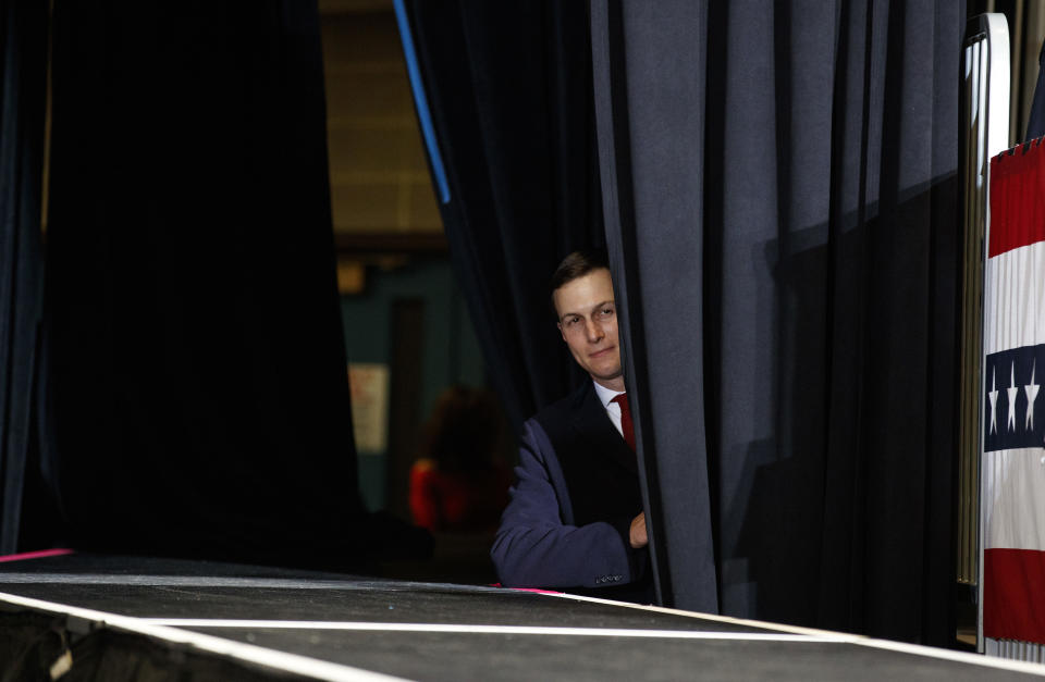 FILE - In this Nov. 5, 2018 file photo, Jared Kushner looks out from back stage before President Donald Trump arrives to speak to a rally at Show Me Center, in Cape Girardeau, Mo.. There is little enthusiasm among U.S. allies for Jared Kushner's planned Mideast conference at the end of June, 2019. The conference, presented as phase one of his long-awaited plan for peace between Israelis and Palestinians, has put pro-Western countries like Jordan and the Saudi Arabia in a difficult position. They can't afford to snub an invitation from their American benefactors but are wary of endorsing a plan that does not include Palestinian independence. (AP Photo/Carolyn Kaster, File)