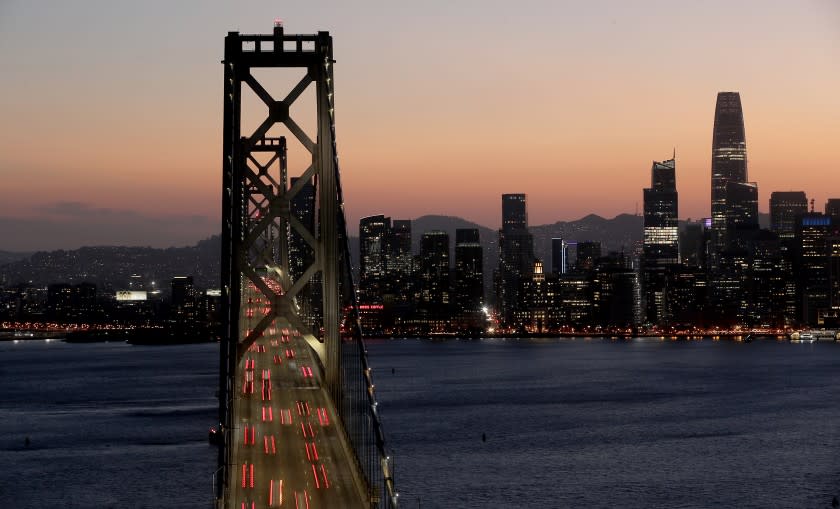 SAN FRANCISCO CA - OCT. 23, 2020. Traffic streams into San Francisco on the Oakland Bay Bridge on Friday, Aug. 23, 2020. San Francisco has done an excellent job following public health guidance and made a huge leap from the coronavirus orange tier to the less restrictive yellow tier, providing a pathway for more businesses and activities to reopen. (Luis Sinco / Los Angeles Times)