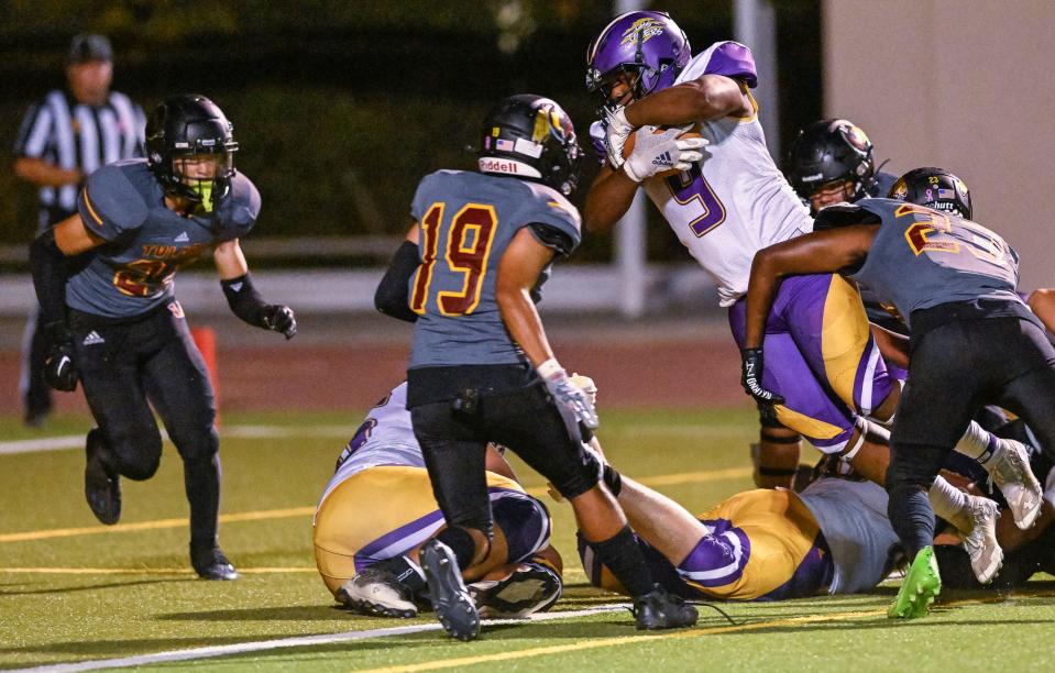 Lemoore's Trevon Gaffney dives over the goal line against Tulare Union in a West Yosemite League high school football game Thursday, September 28, 2023.