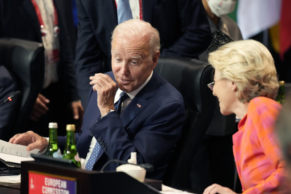 U.S. President Joe Biden talks with European Commission President Ursula von der Leyen before she co-hosts the Partnership for Global Infrastructure and Investment at the G20 summit meeting, Tuesday, Nov. 15, 2022, in Nusa Dua, Bali, Indonesia. (AP Photo/Alex Brandon)