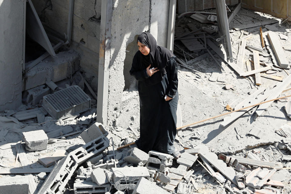 A woman at the site of Israeli strikes on houses in Rafah.