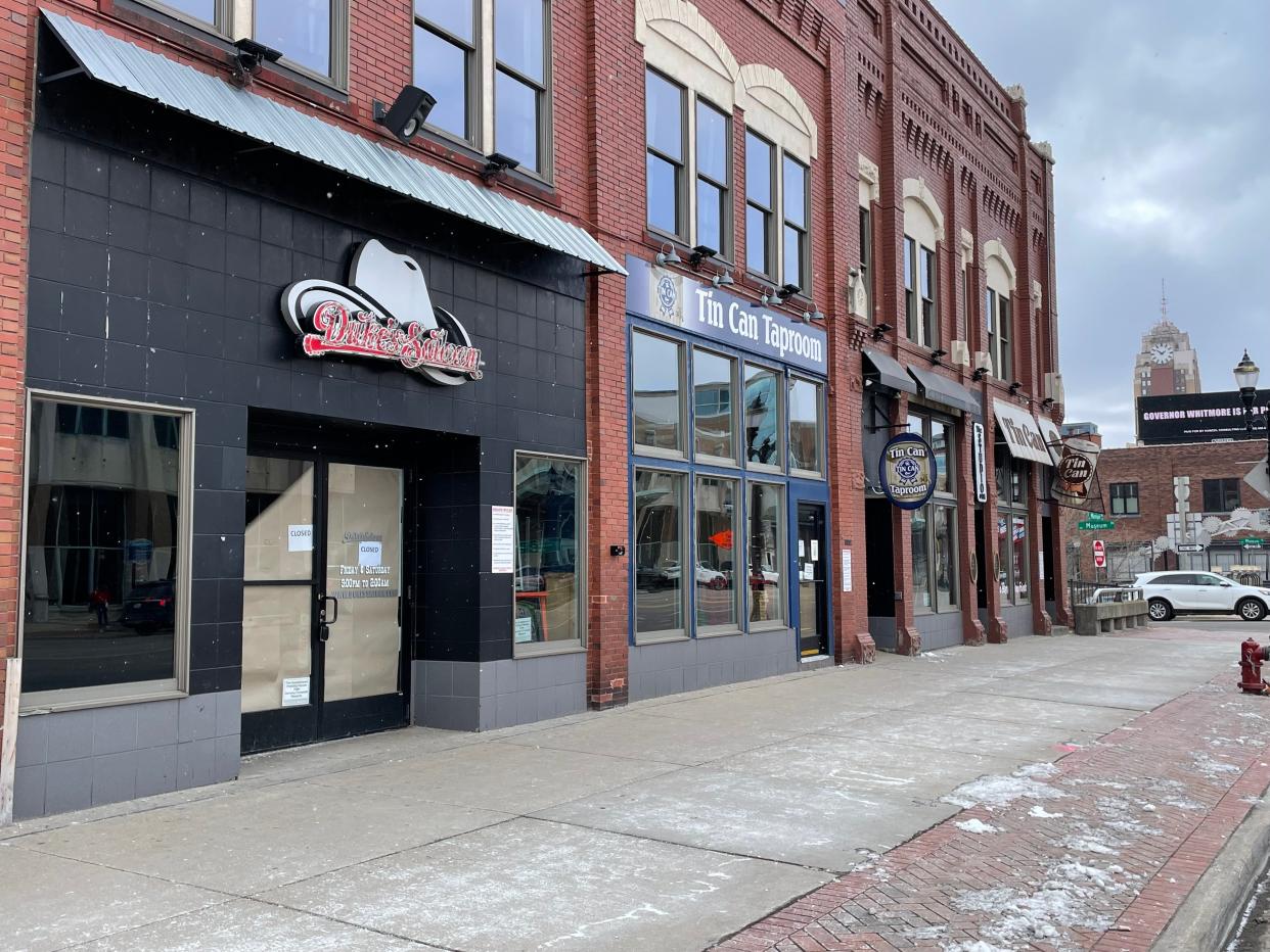 The front doors of Duke's Saloon, 414 E. Michigan Ave., are papered over and a sign says the business is closed.