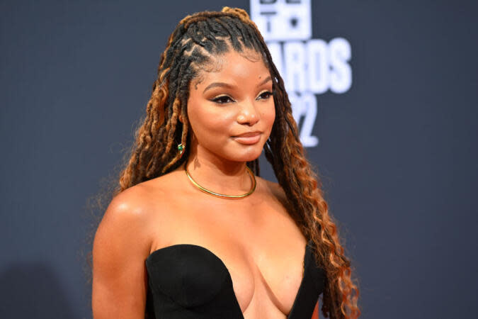 Check out this list of young Black actresses that are expected to take over the entertainment industry. Pictured: Halle Bailey wearing a Black dress and posing at the BET Awards 2022 red carpet. | Paras Griffin/Getty Images for BET