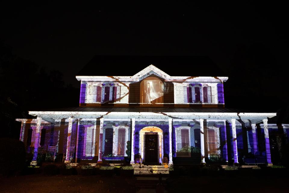 A series of Halloween themed projections are displayed on Carl Fuqua’s Southwood home Friday, Oct. 21, 2022.