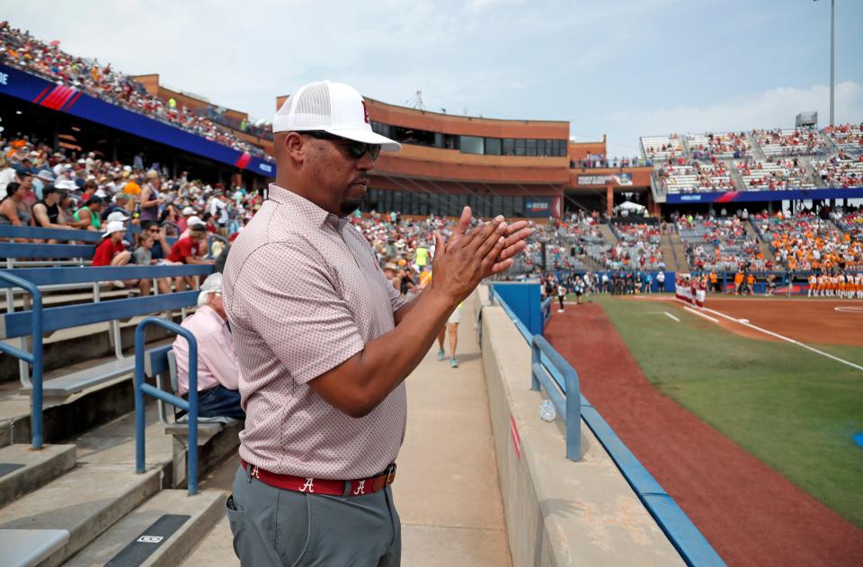 Jeff Torrence cheers before a softball game between Tennessee and Alabama in the Women's College World Series at USA Softball Hall of Fame Stadium in Oklahoma City, Thursday, June 1, 2023. 