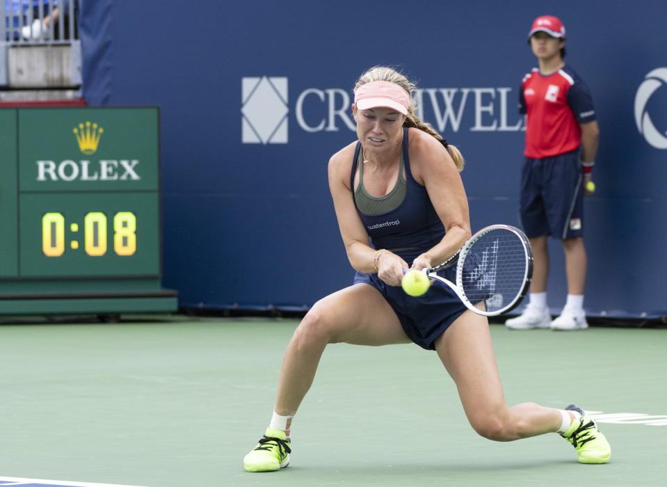 Danielle Collins hits a return to Elina Svitolina, of Ukraine, during the National Bank Open tennis tournament in Montreal, Tuesday, Aug. 8, 2023. (Christinne Muschi/The Canadian Press via AP)