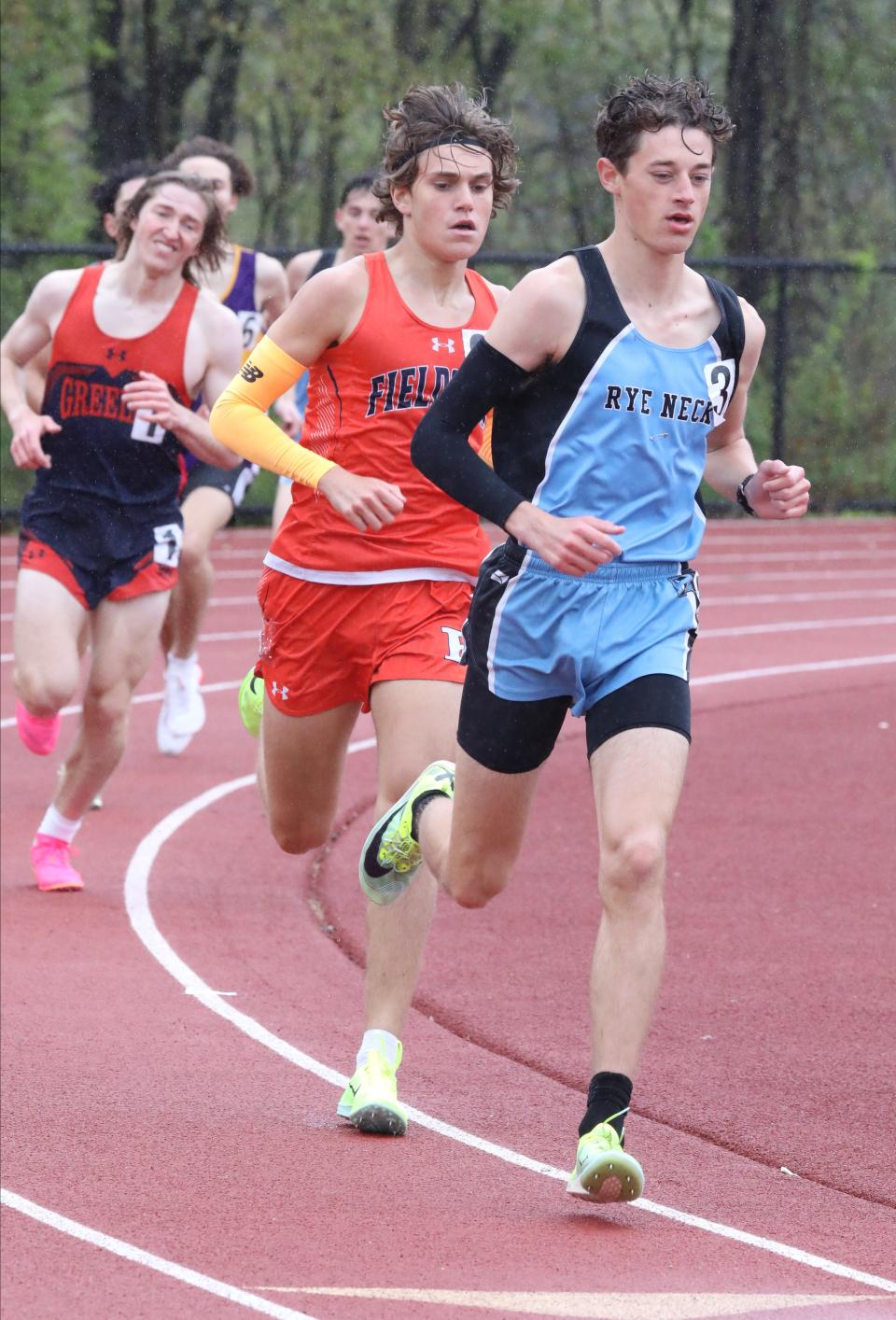 Joseph Lavelle from Rye Neck runs in front of eventual winner, Owen Larson from the Ethical Culture Fieldston school, as athletes compete in the boys 1600 meter run during the Gold Rush Invitational Track & Field meet at Clarkstown South High School in West Nyack, April 29, 2023. 