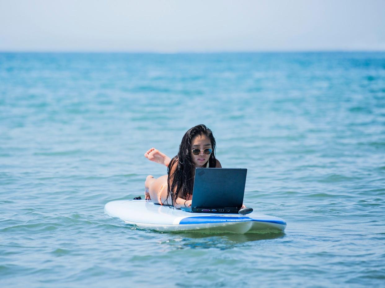 Working remotely laptop beach