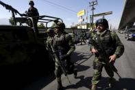 Soldiers walk near the Topo Chico prison in Monterrey, Mexico, February 11, 2016. REUTERS/Daniel Becerril