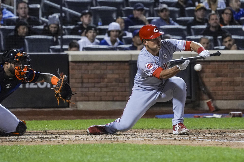 Cincinnati Reds' Luke Maile attempts a bunt during the fifth inning of the team's baseball game against the New York Mets, Friday, Sept. 15, 2023, in New York. Maile struck out on the at-bat. (AP Photo/Bebeto Matthews)