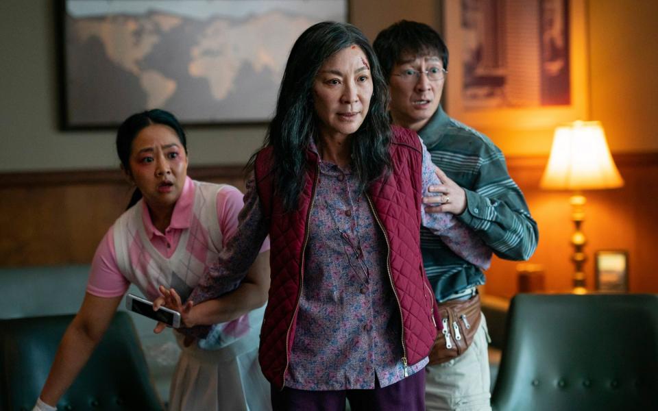 Ke Huy Quan with co-stars Stephanie Hsu Michelle Yeoh (centre) in Everything Everywhere All at Once, 2022 - AP