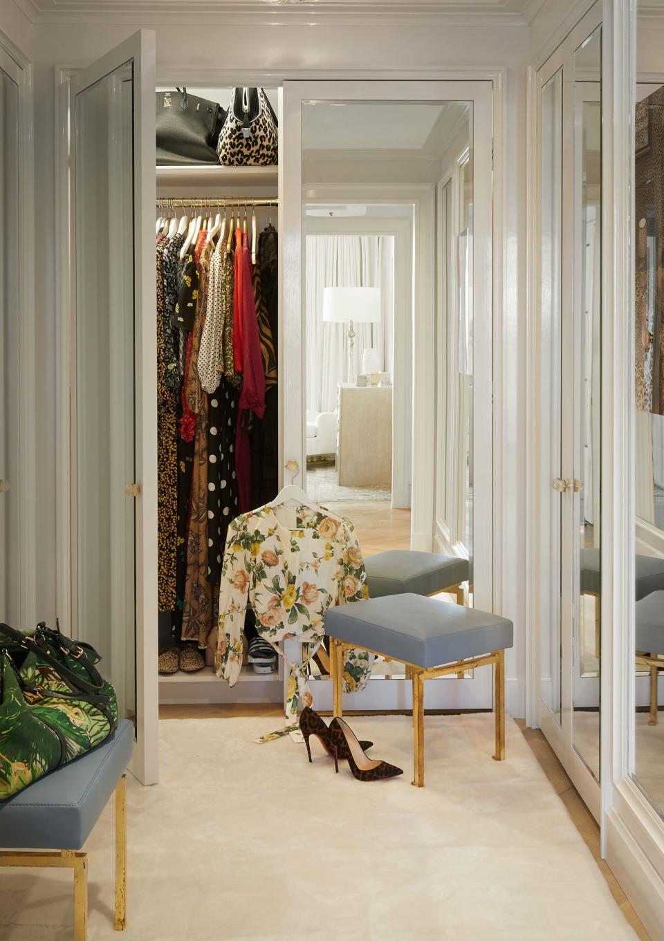 An ivory shearling Stark carpet dresses the floor of a master closet.